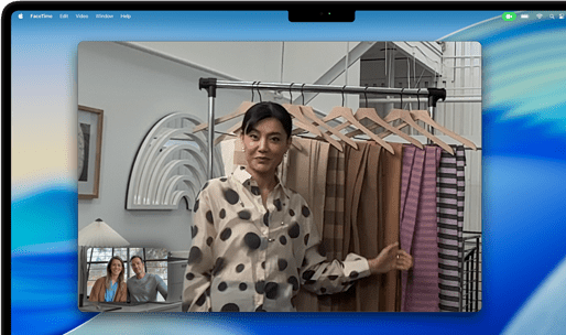 A video call on a MacBook Pro where a woman shows fabrics to two people on the call, with Center Stage keeping her centered in the frame as she moves around