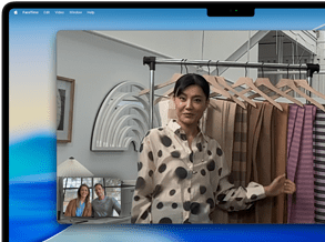 A video call on a MacBook Pro where a woman shows fabrics to two people on the call, with Center Stage keeping her centered in the frame as she moves around