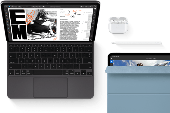 iPad Pro attached to Magic Keyboard, front exterior, space black color, rounded corners, black display bezel, open, display showing article editing app with text and photograph of a woman playing music, Airpods 4 in open case, blue Smart Folio cover on iPad Pro with Apple Pencil Pro resting atop device, cover slightly open revealing display