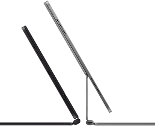 2 iPad Pro devices attached to Magic Keyboard, side exterior, thin profile, space black color with speakers and USB-C port, tilted half open, silver color, open, tilted back showing the keyboard’s floating cantilever design, speakers and microphone