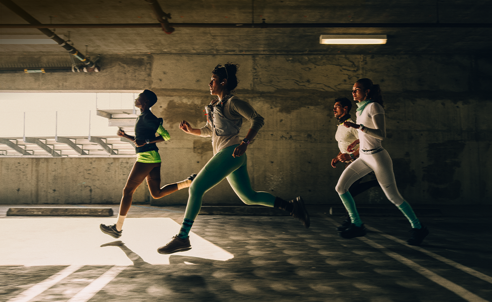 A group of people running in a city while wearing Apple Watch Series 12